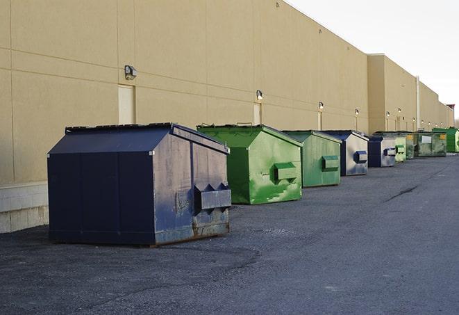 construction-grade dumpsters ready for use in Gonzales